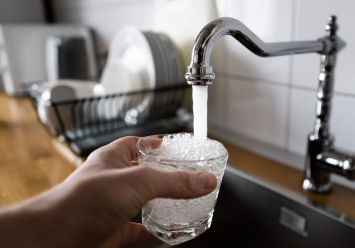 Glass filling up with water from faucet