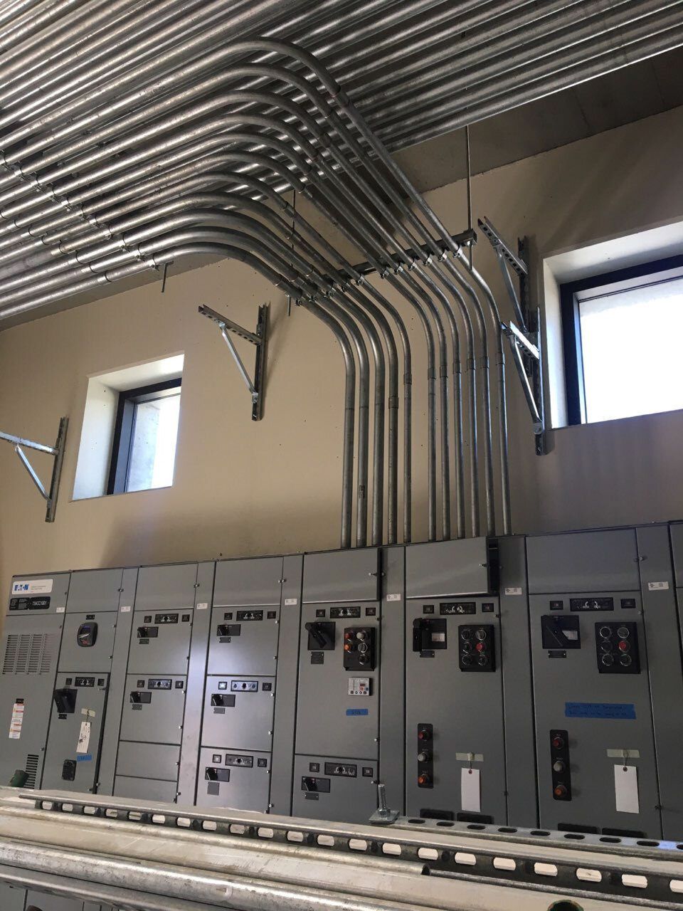 Overhead conduit to panel